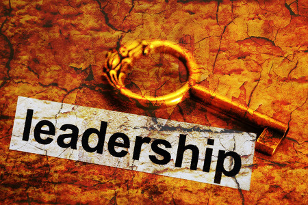 A golden key next to the word leadership