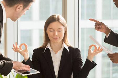 business woman meditationg at work