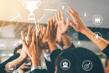 Team celebrating success with high-fives under a trophy icon, symbolizing teamwork, leadership, collaboration, and business achievement.