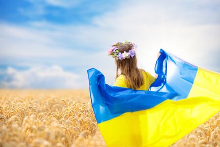 girl holding ukrainian flag