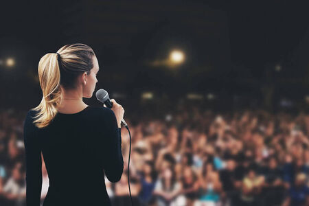 female speaker on stage